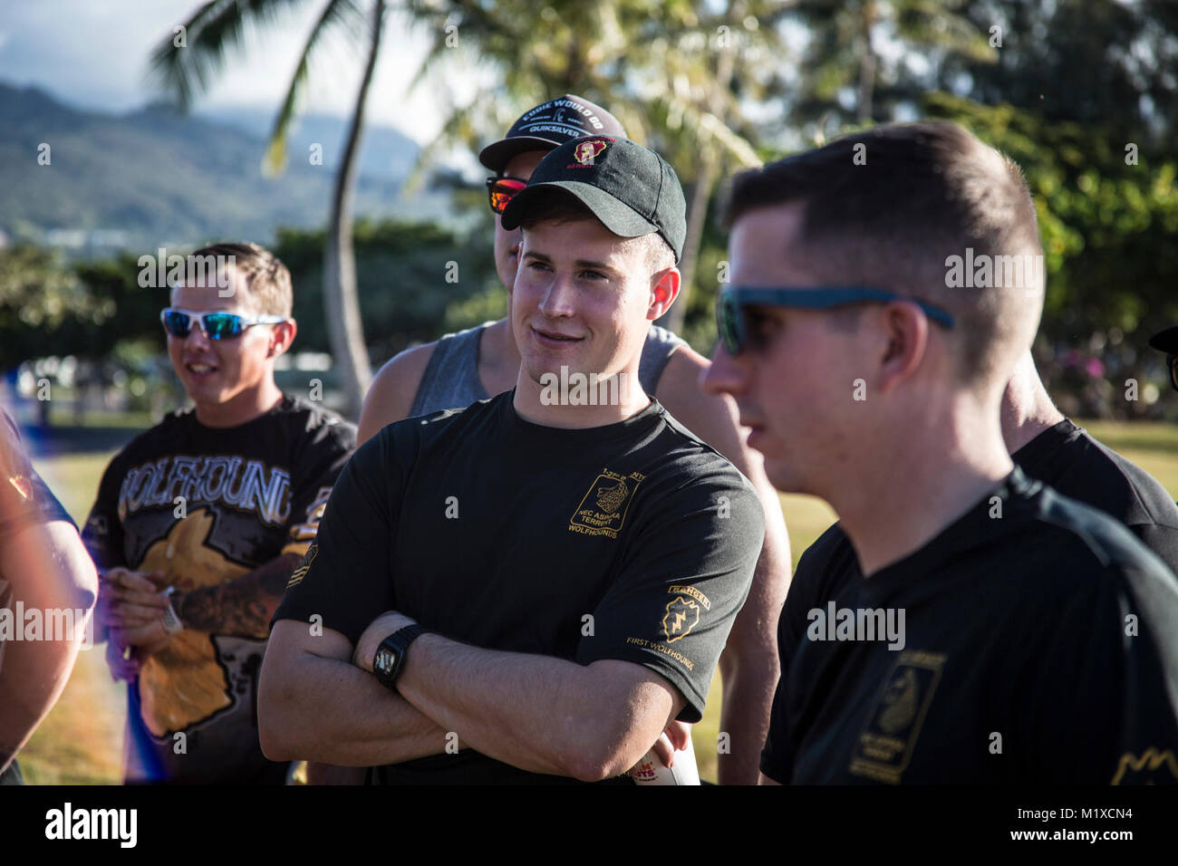 U.S. Army 1st. Lt. Nicholas Keeley, assigned to 1st Battalion, 27th Infantry Regiment, 2nd Infantry Brigade Combat Team, 25th Infantry Division listens to group introductions before the start of the team-building exercise in Keehi Lagoon, Honolulu, Hi., Jan. 30, 2018. In an effort to strengthen international relationships, United States Army Pacific hosted personnel from the British Army to participate in a team building exercise facilitating outrigger canoeing. (U.S. Army Stock Photo