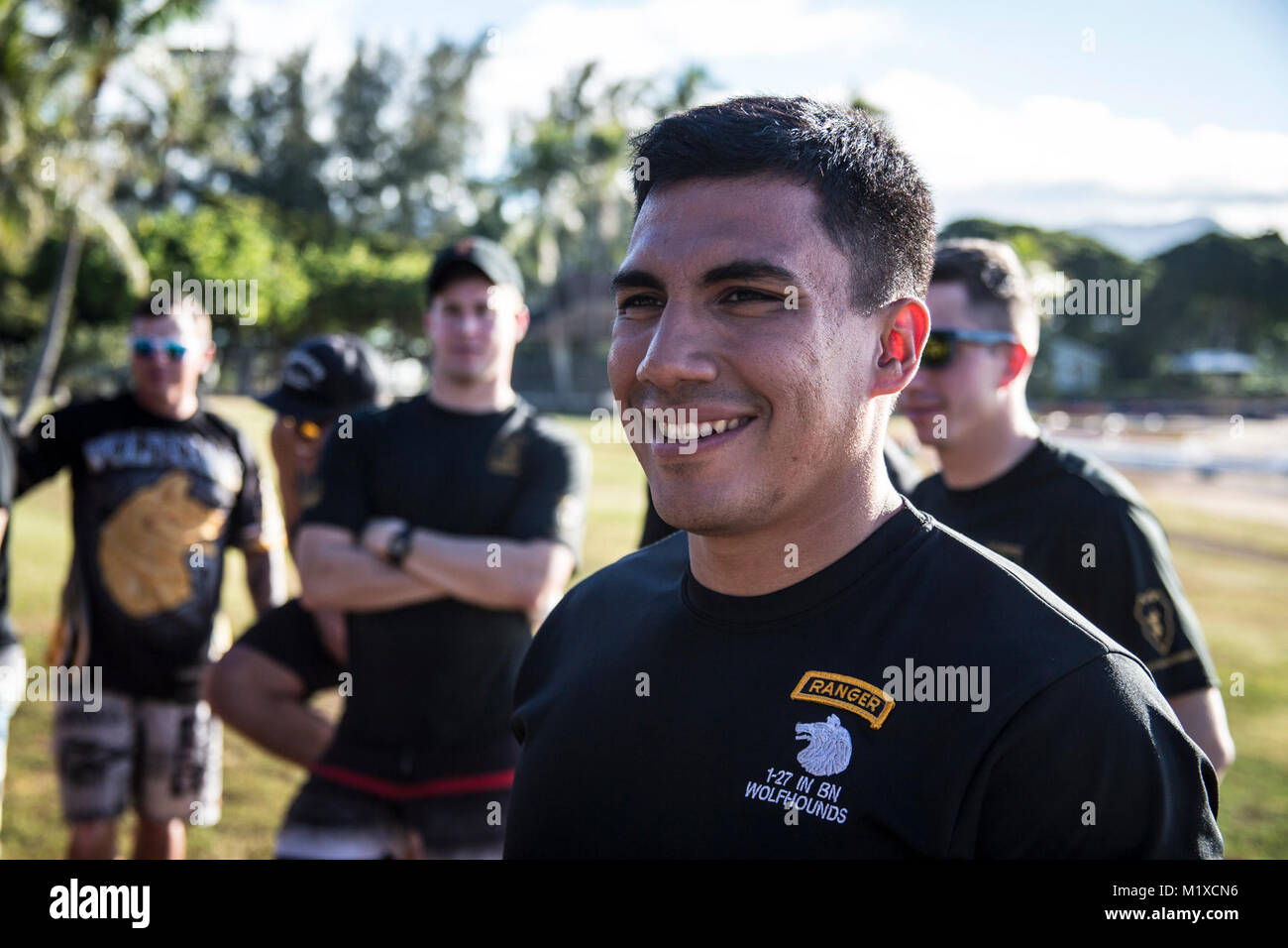 U.S. Army Capt. David Zelaya, assigned to 1st Battalion, 27th Infantry Regiment, 2nd Infantry Brigade Combat Team, 25th Infantry Division listens to group introductions before the start of the team-building exercise in Keehi Lagoon, Honolulu, Hi., Jan. 30, 2018. In an effort to strengthen international relationships, United States Army Pacific hosted personnel from the British Army to participate in a team building exercise facilitating outrigger canoeing. (U.S. Army Stock Photo