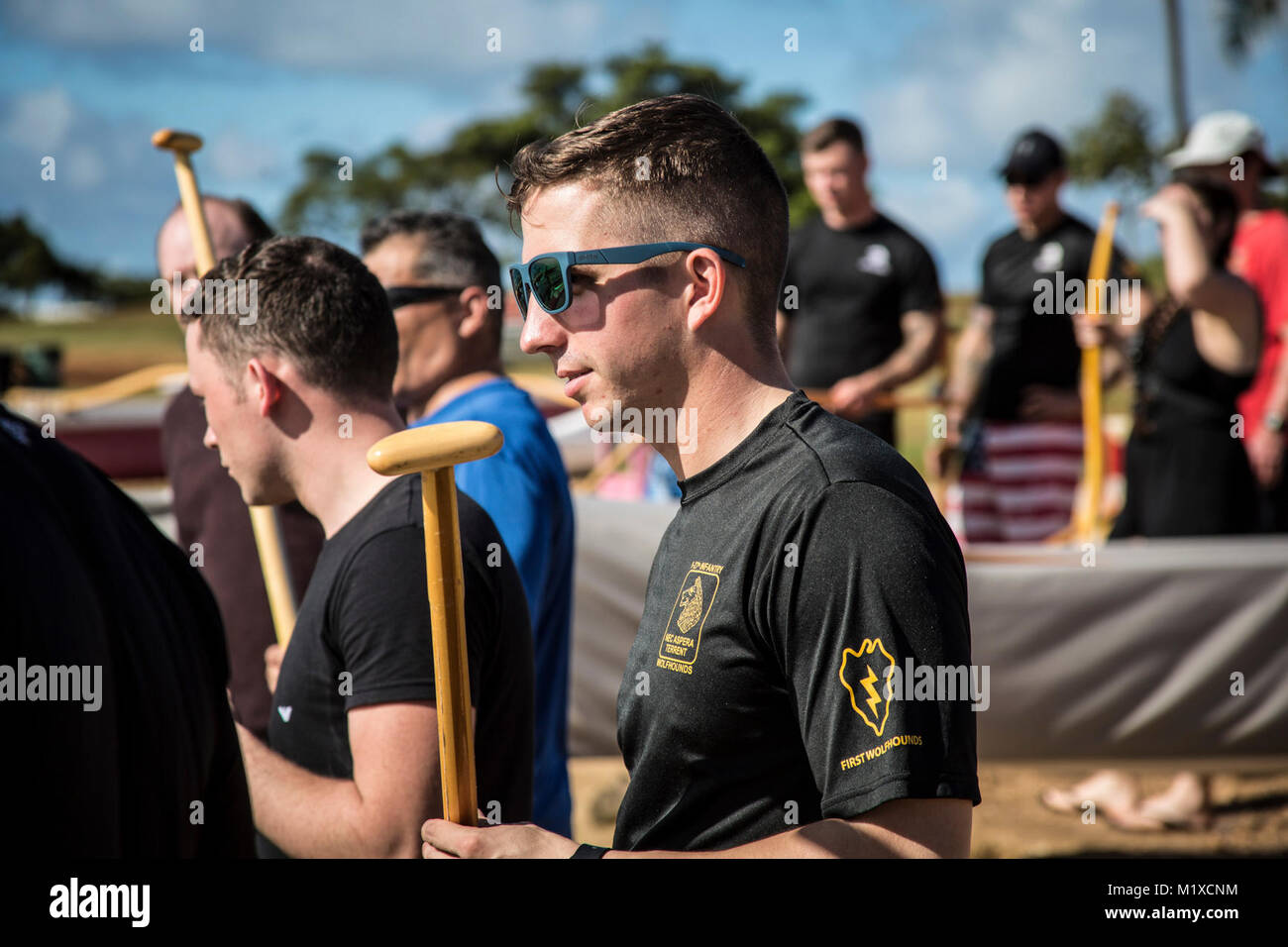 U.S. Army 2nd. Lt. Weston Iannone, assigned to 1st Battalion, 27th Infantry Regiment, 2nd Infantry Brigade Combat Team, 25th Infantry Division listens to paddle instruction before the start of the team-building exercise in Keehi Lagoon, Honolulu, Hi., Jan. 30, 2018. In an effort to strengthen international relationships, United States Army Pacific hosted personnel from the British Army to participate in a team building exercise facilitating outrigger canoeing. (U.S. Army Stock Photo