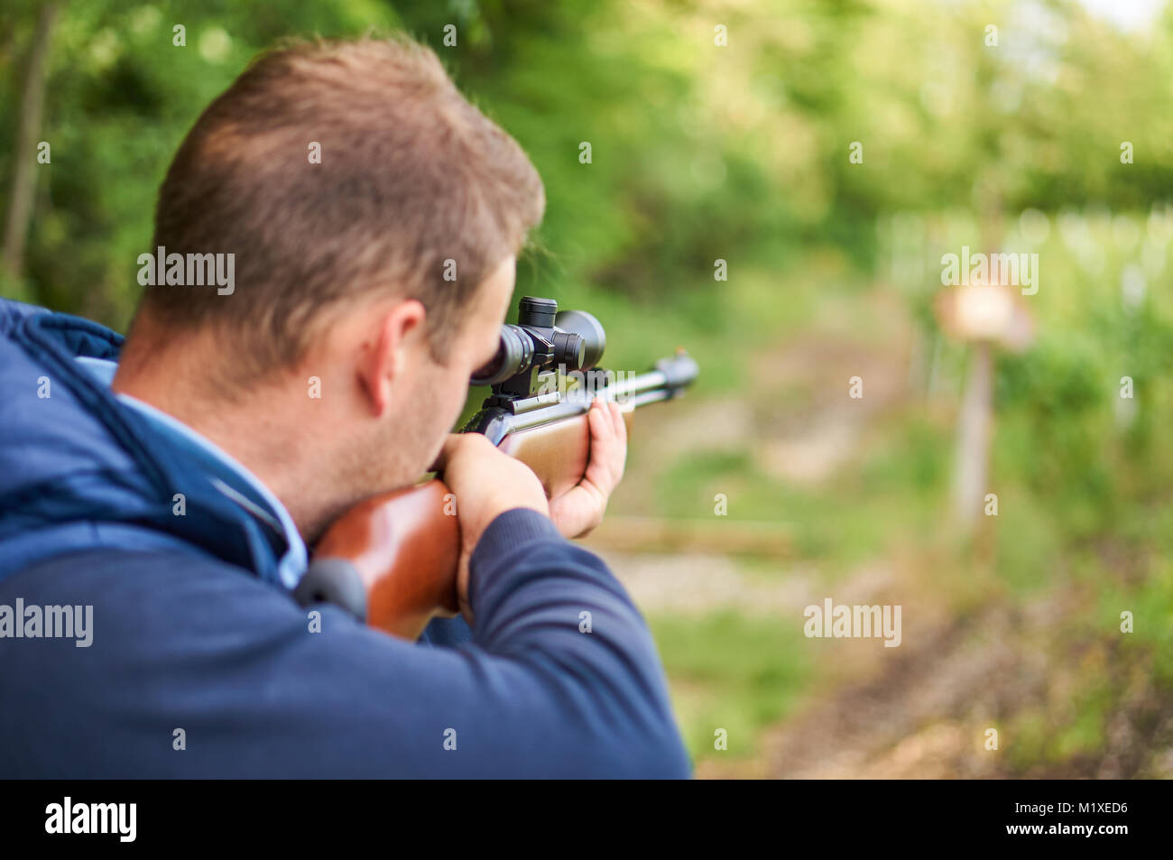 Man with air rifle. Stock Photo