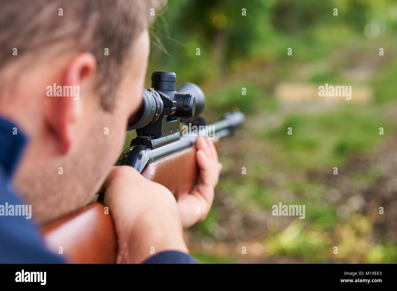 Man with air rifle. Stock Photo