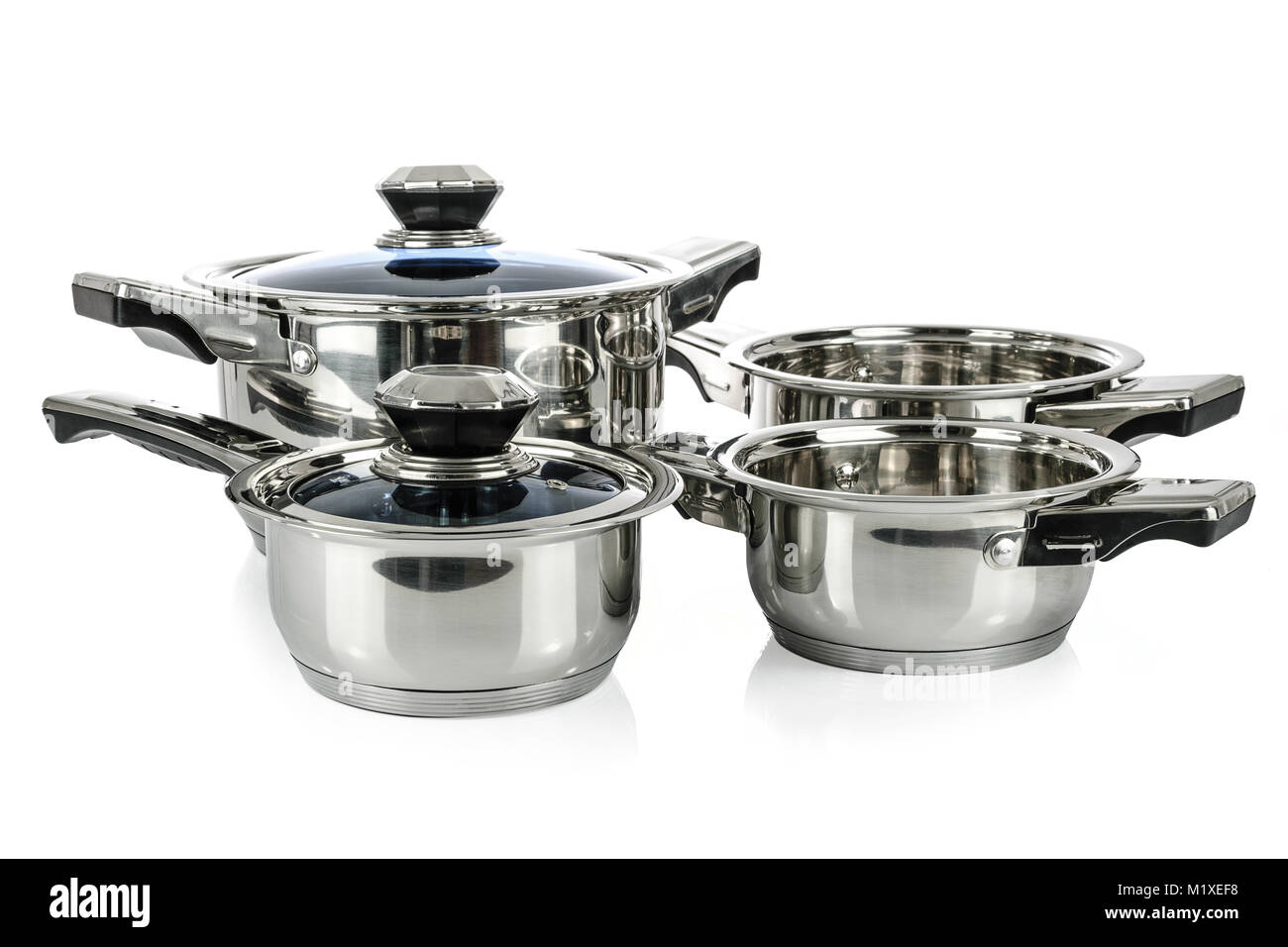 Group of premium stainless steel pots and pans isolated on a white