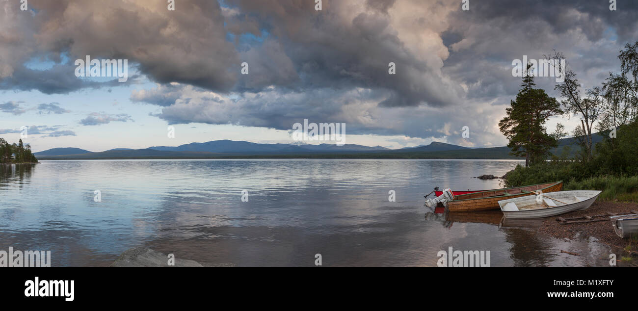 Boats on shore of lake in Jatmland, Sweden Stock Photo
