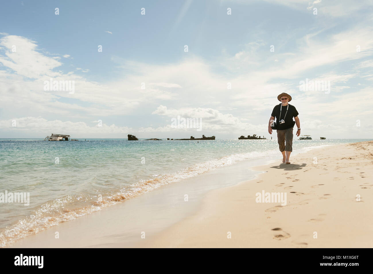 Woman Walking On Beach High Resolution Stock Photography and Images - Alamy