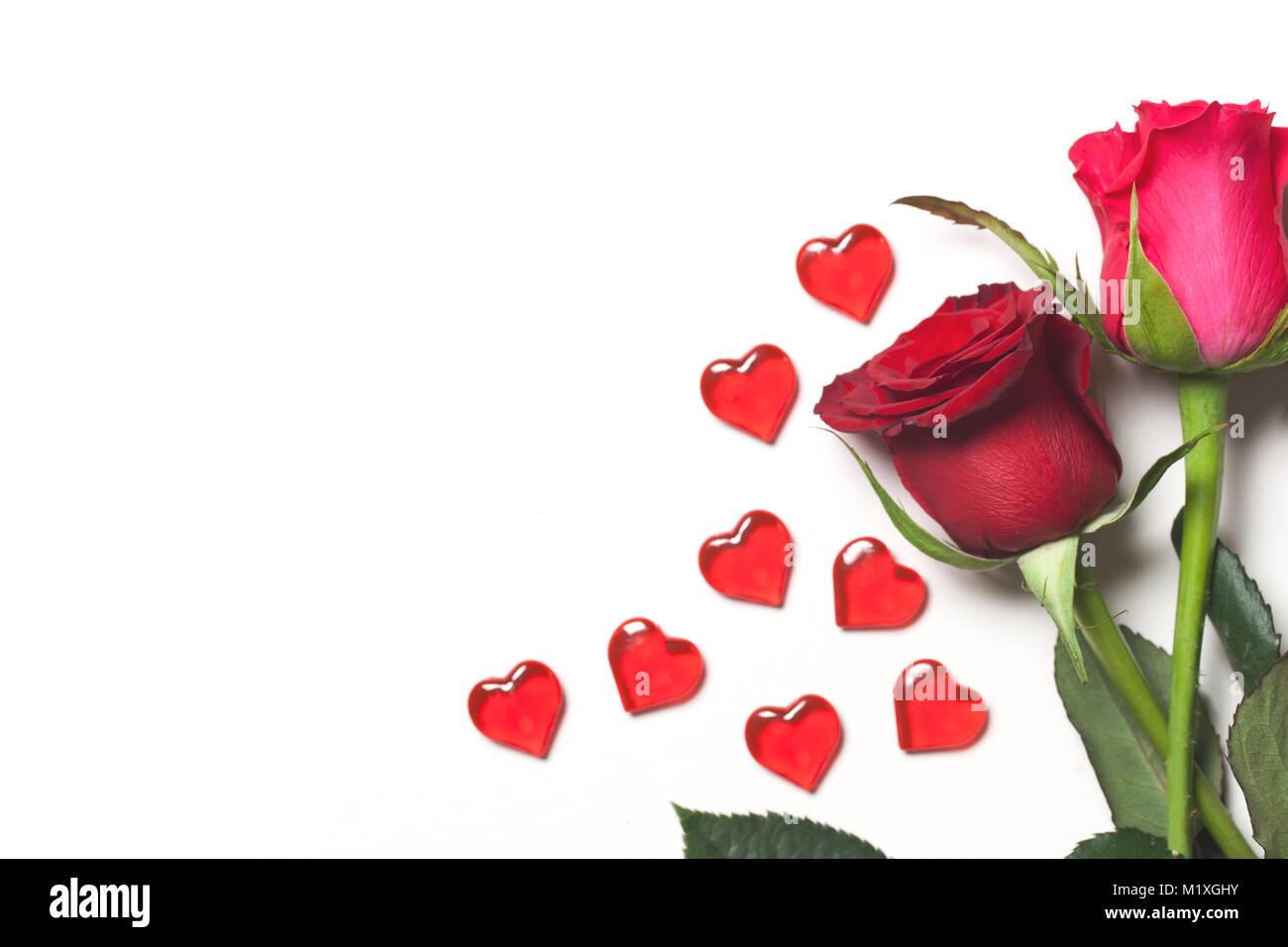 Roses and hearts arranged on a white background Stock Photo - Alamy