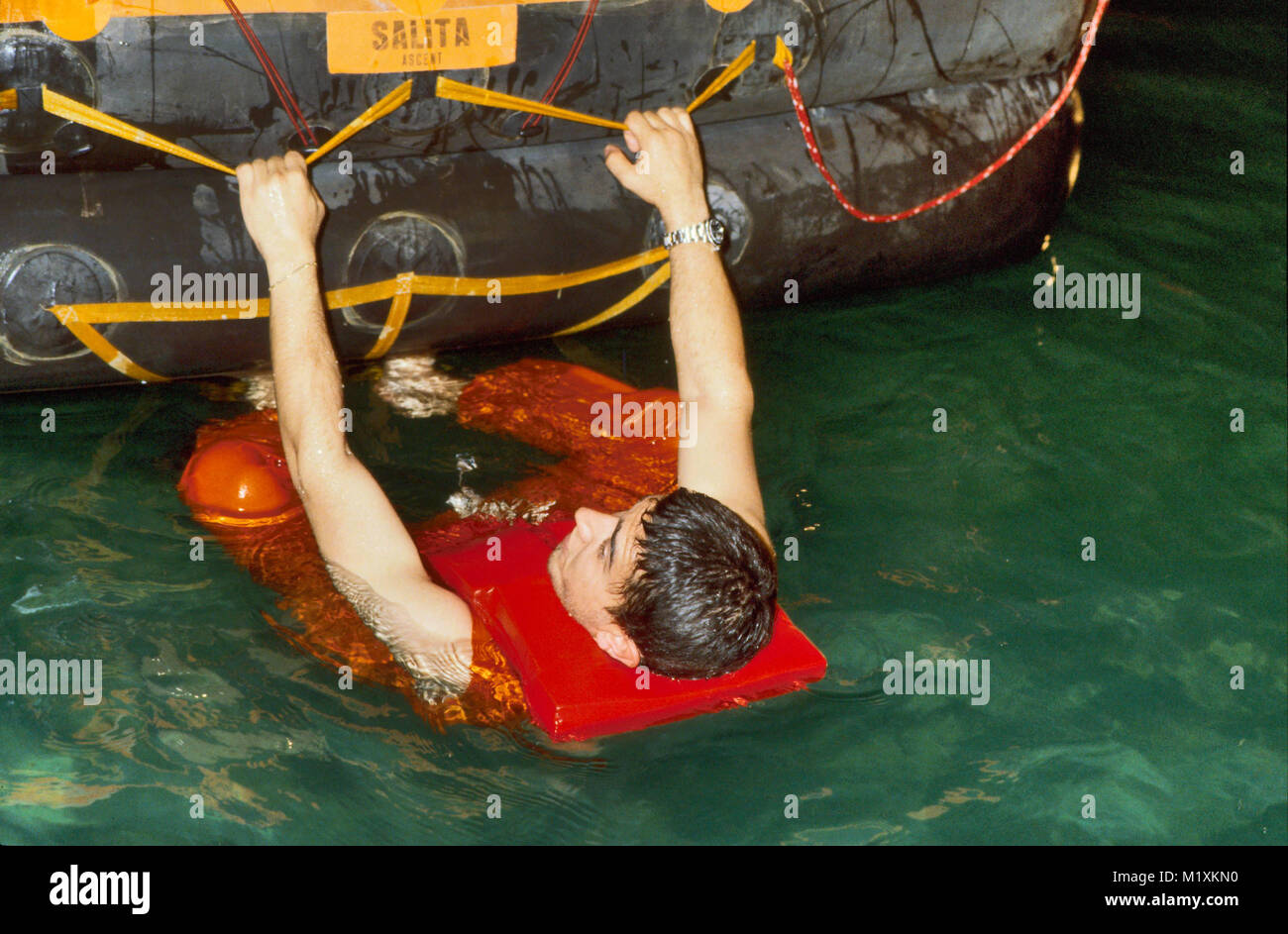 APT, fire and accident prevention school for personnel involved in  dangerous works, swimming pool exercise with life raft in the event of a  shipwreck (Bornasco, Pavia, Italy Stock Photo - Alamy