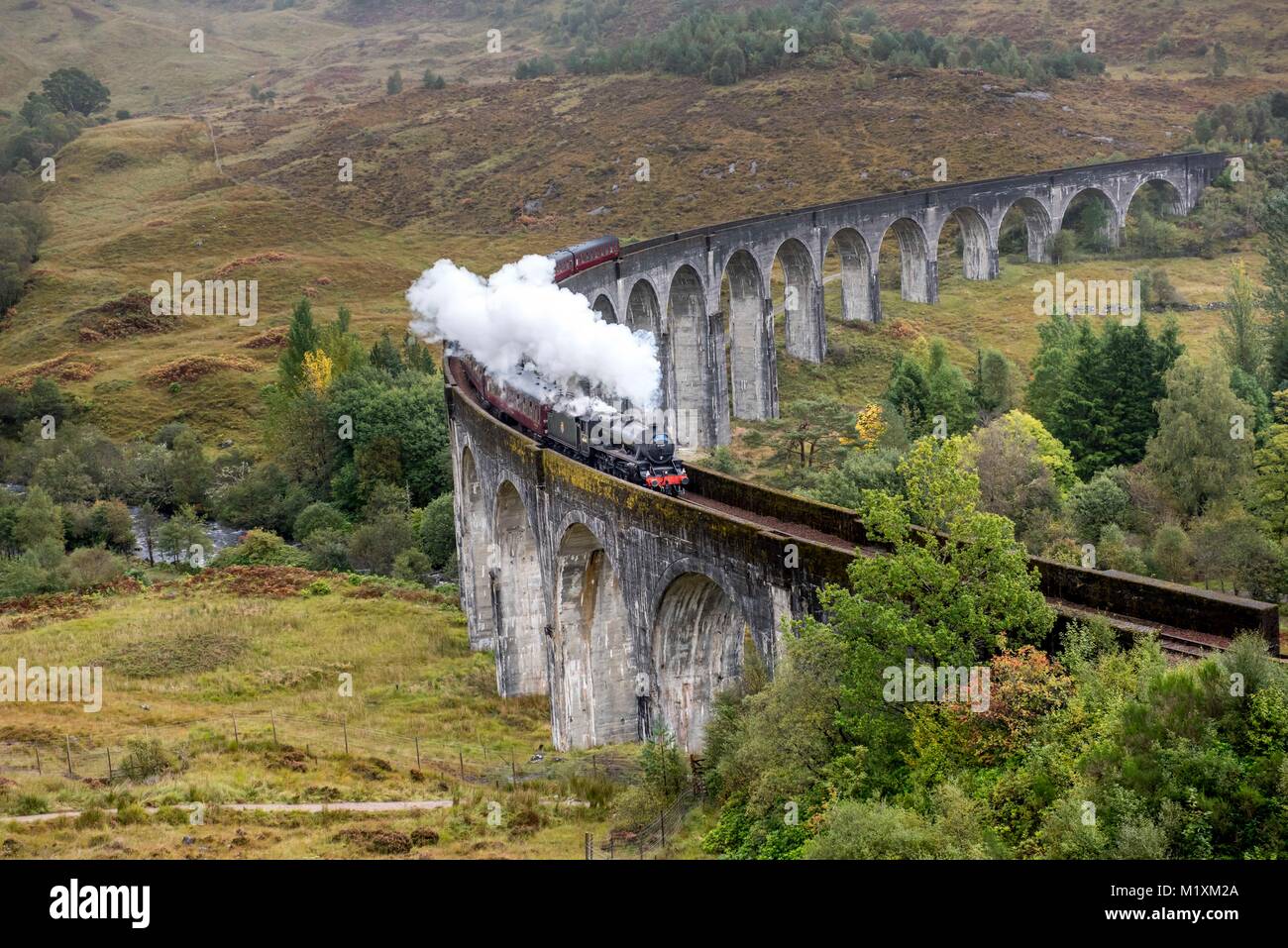 Scotland 2017 The Jacobite steam train from Fort William to Mallaig in Scotland crosses the Glenfinnan viaduct  Stock Photo