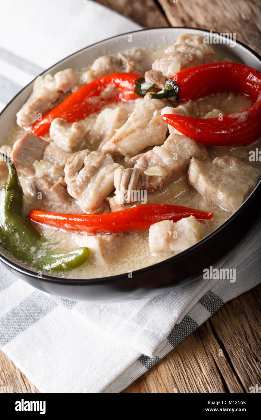Filipino cuisine stewed spicy pork in coconut milk with chili pepper