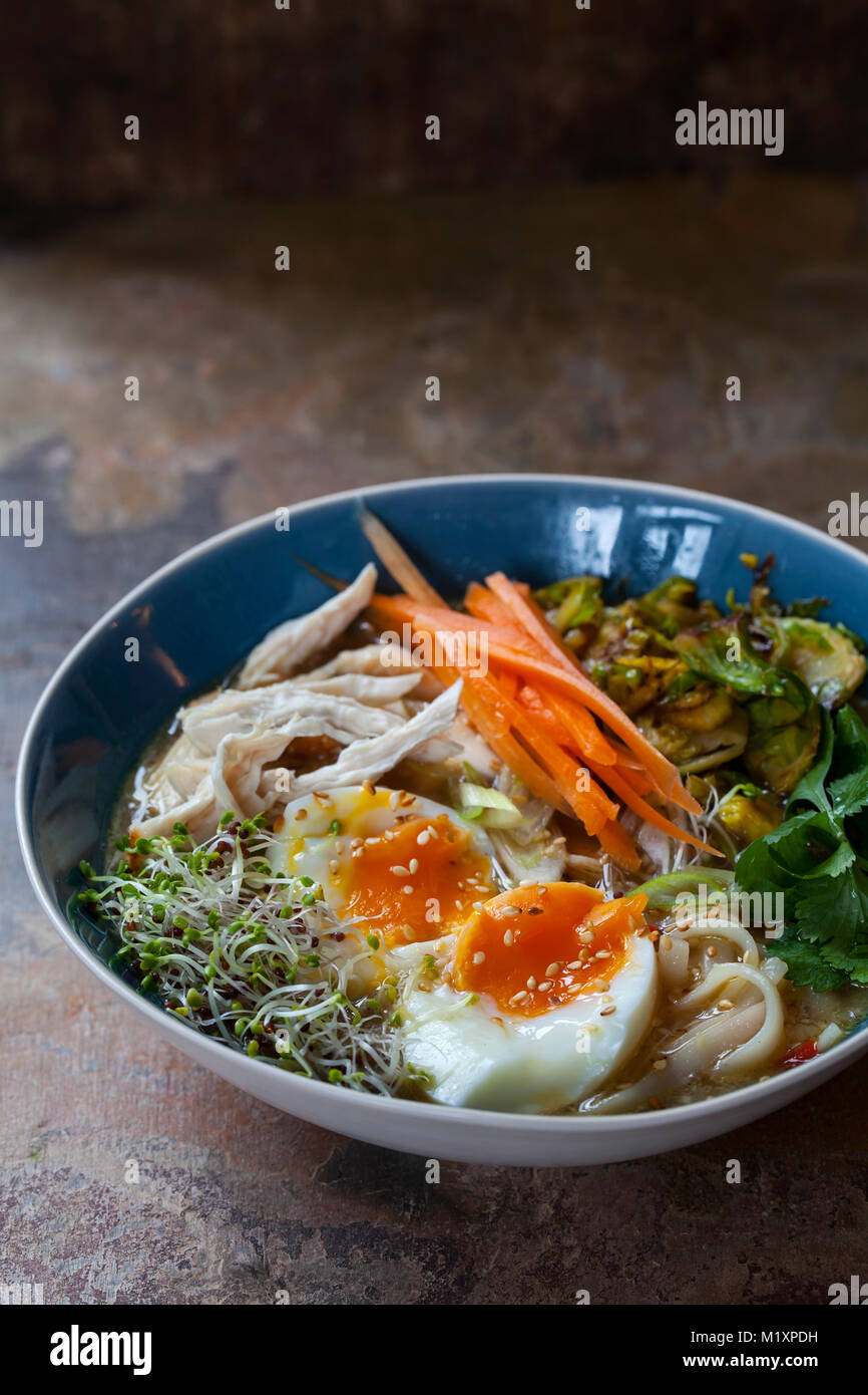 Ramen with egg, chicken and fried brussel sprouts Stock Photo