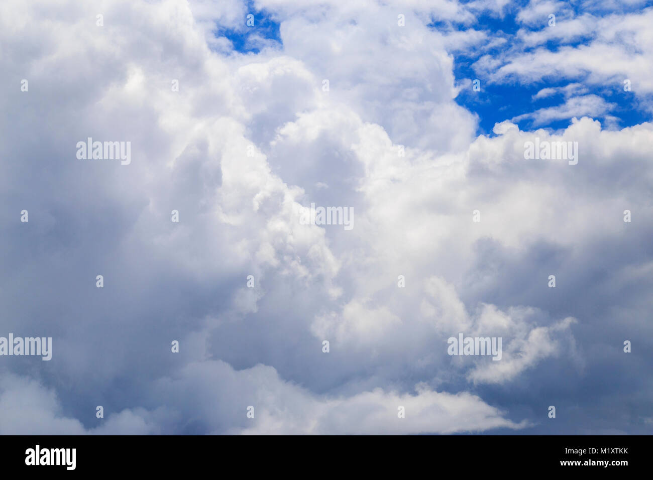 Big white clouds at blue sky view from the airplane seat Stock Photo ...