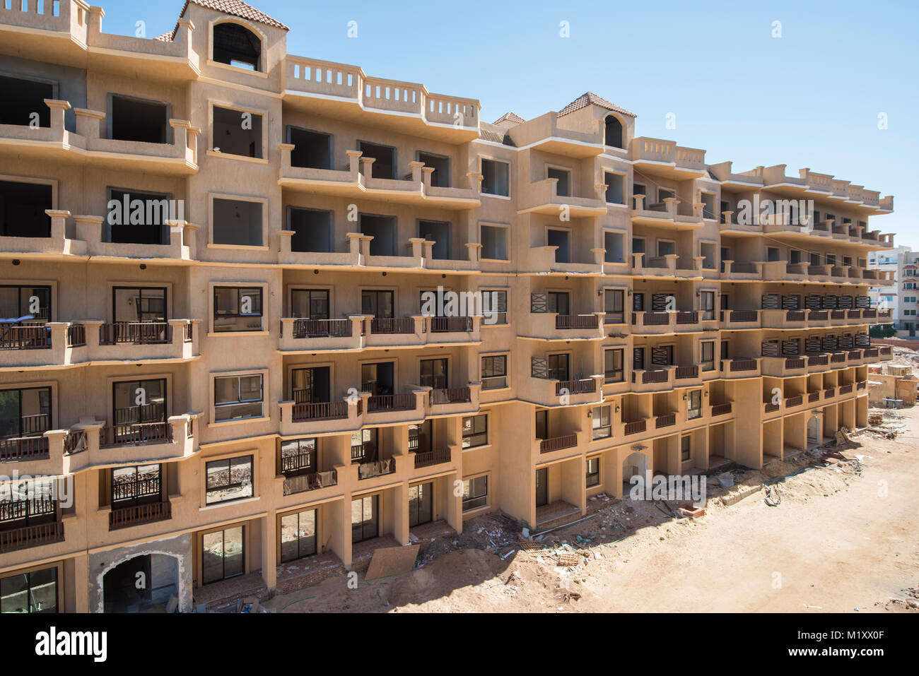 Outside exterior of an apartment block construction project in tropical holiday resort Stock Photo