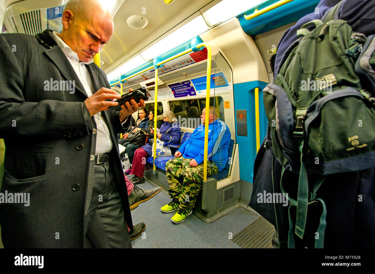London, England, UK. Commuters on a tube train Stock Photo