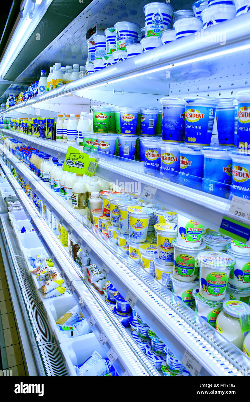 yogurts sour cream and others dairy produce on the shelves of shop