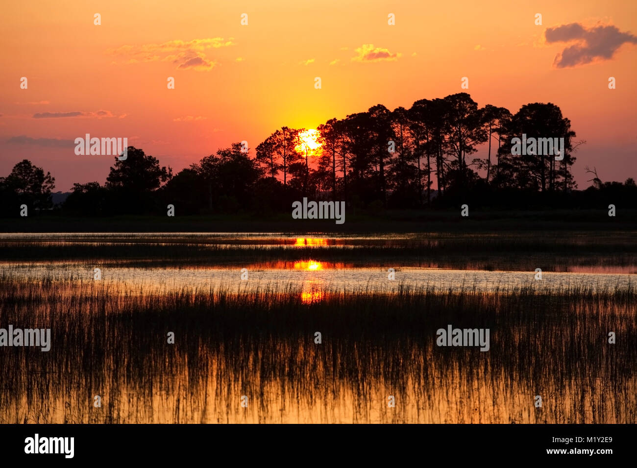 A dramatic sunset over the marsh at Dolphin Head beach on Hilton Head Island, South Carolina. Stock Photo