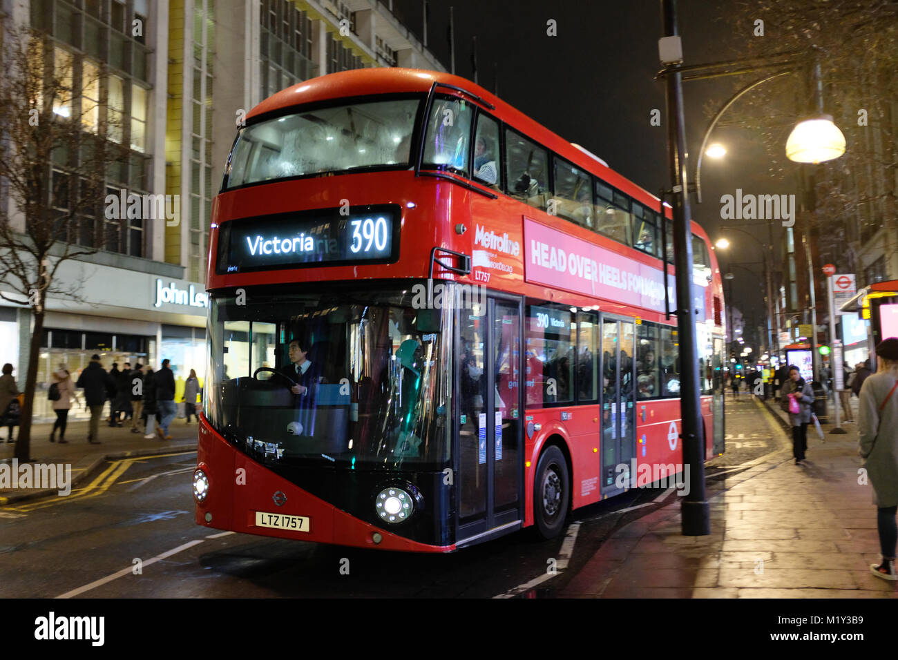 Red double decker bus on Oxford Street, London, England, UK Stock Photo