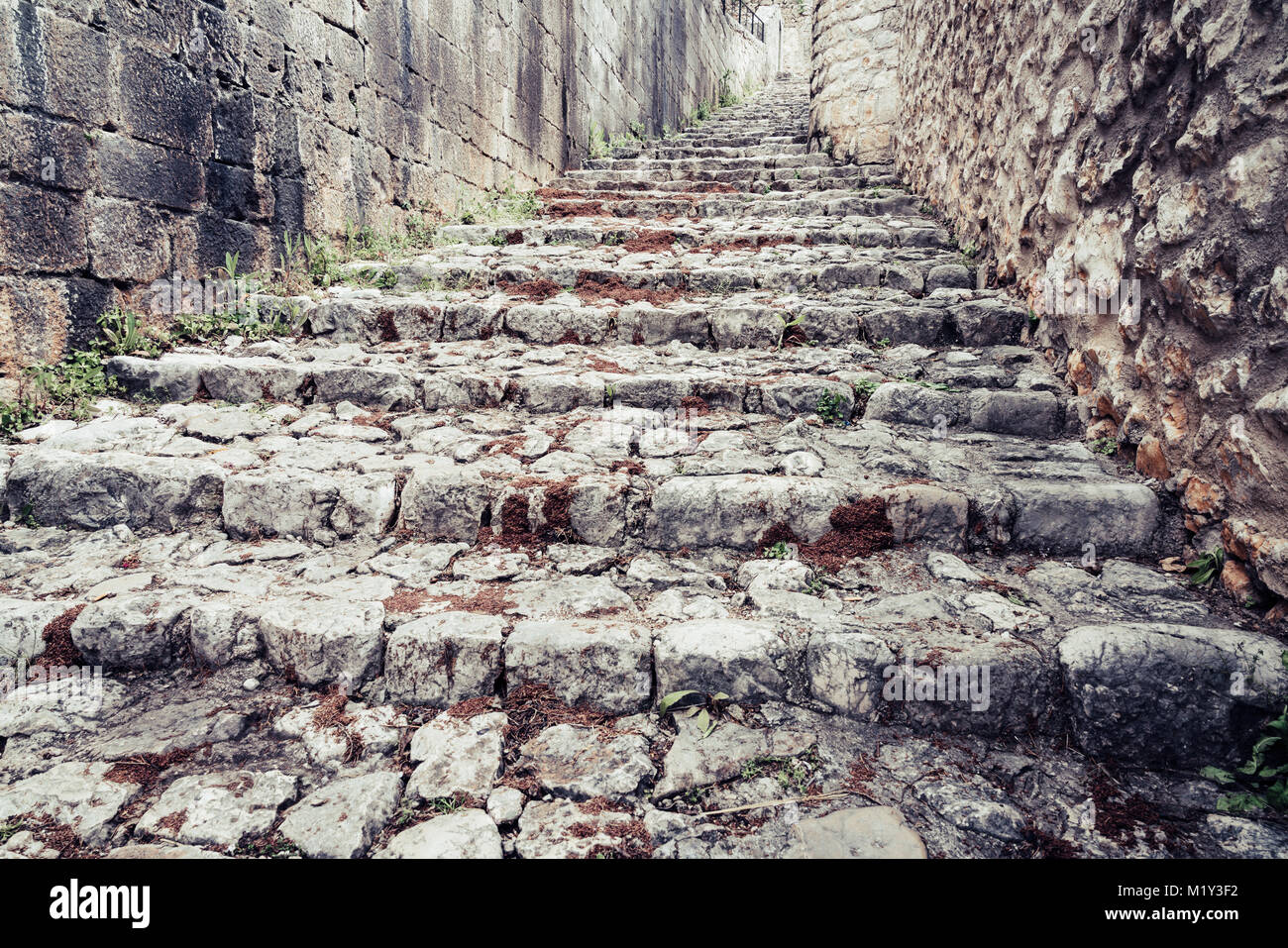 Medieval cobblestone street in a small Bosnian town of Pocitelj Stock Photo