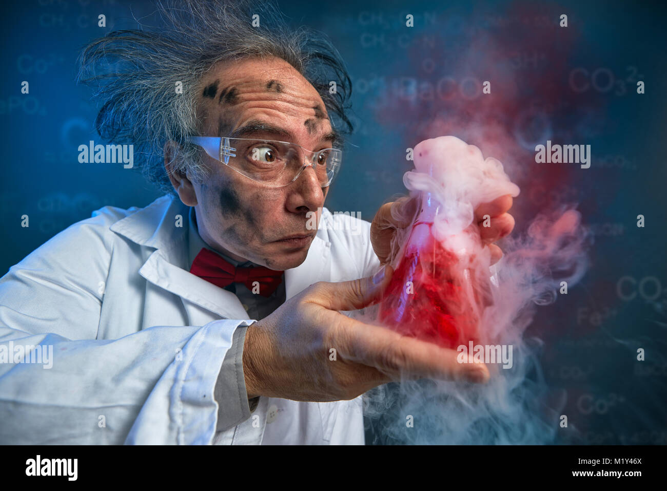 wacky scientist with explosive experiment, funny chemist Stock Photo Alamy