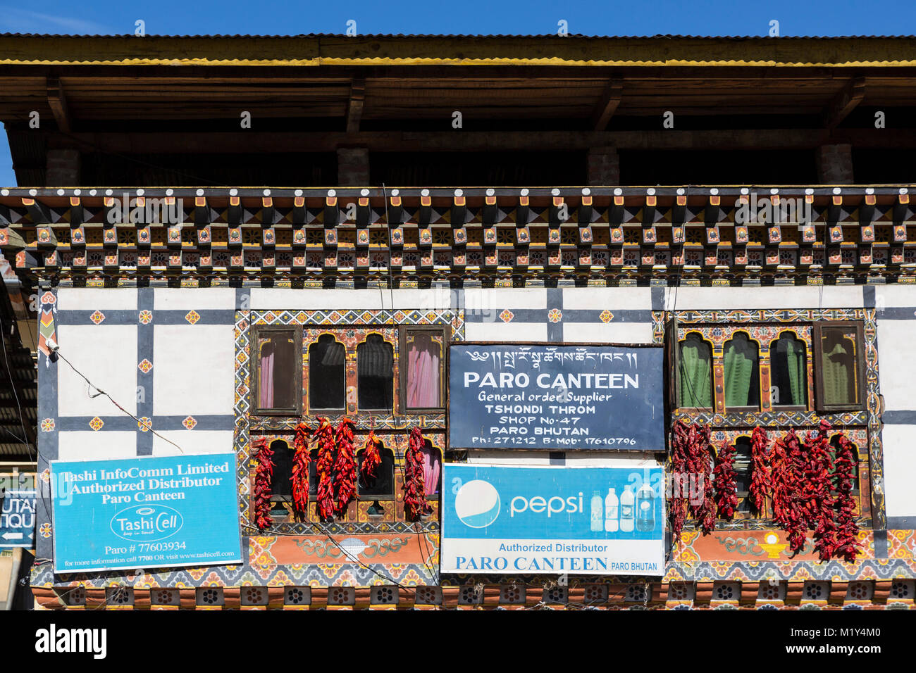 Paro, Bhutan.  Store on Paro's Main Street.  Chili Peppers Drying. Stock Photo