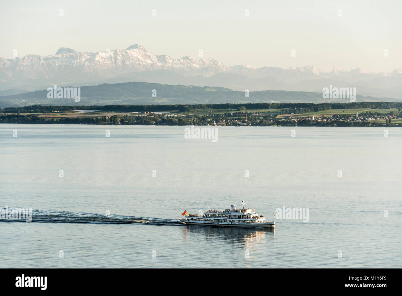 View of Lake Constance with excursion boat, in the back the Swiss Alps with Säntis, near Meersburg, Baden-Württemberg, Germany Stock Photo