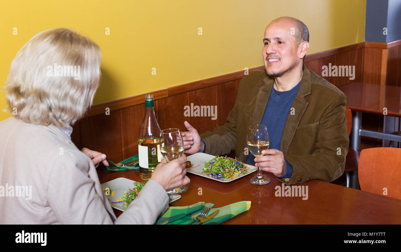 Happy senior couple having dinner at restaurant table Stock Photo Alamy