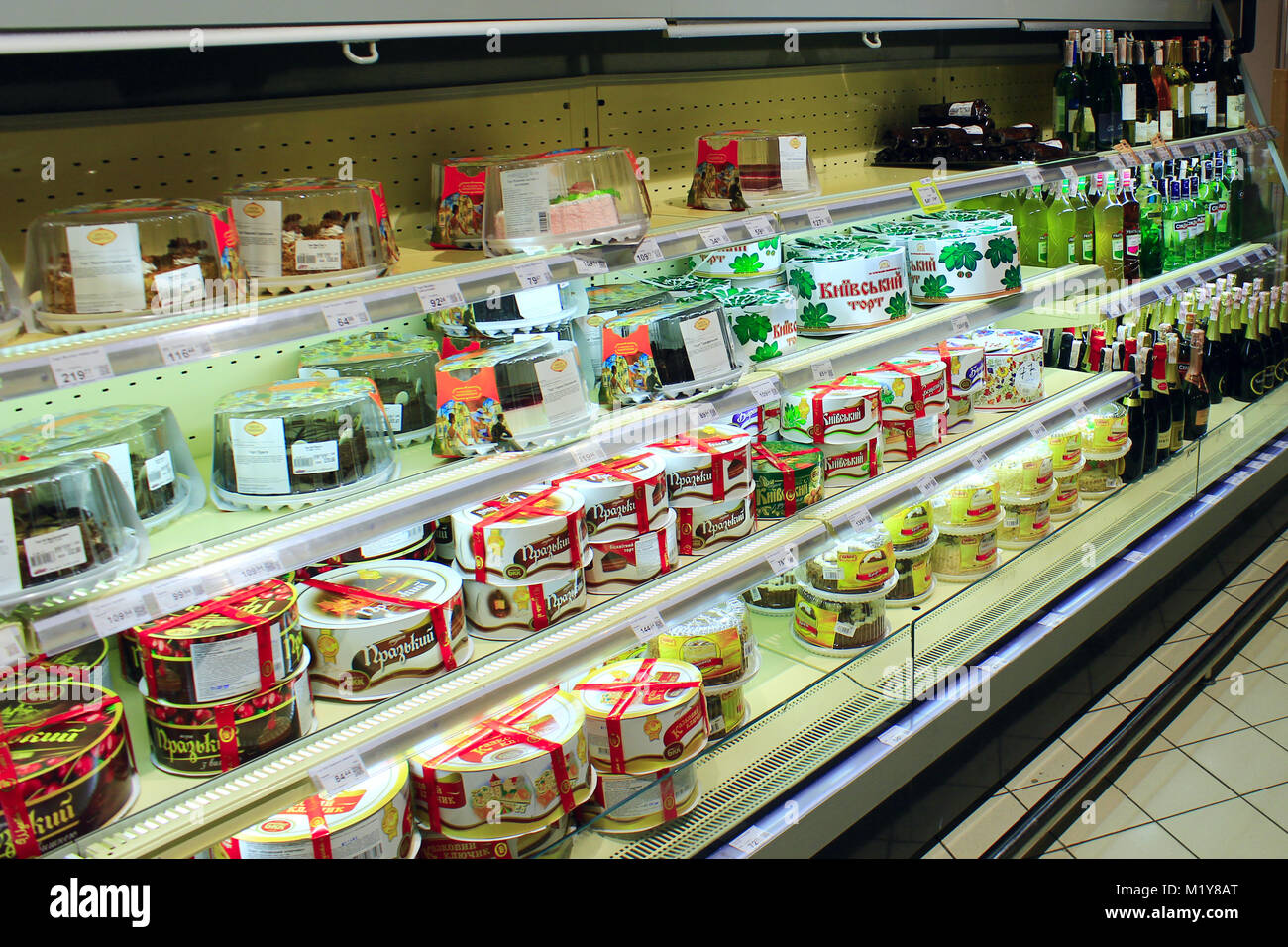 wide choice of different cakes on the shelves of supermarket Stock