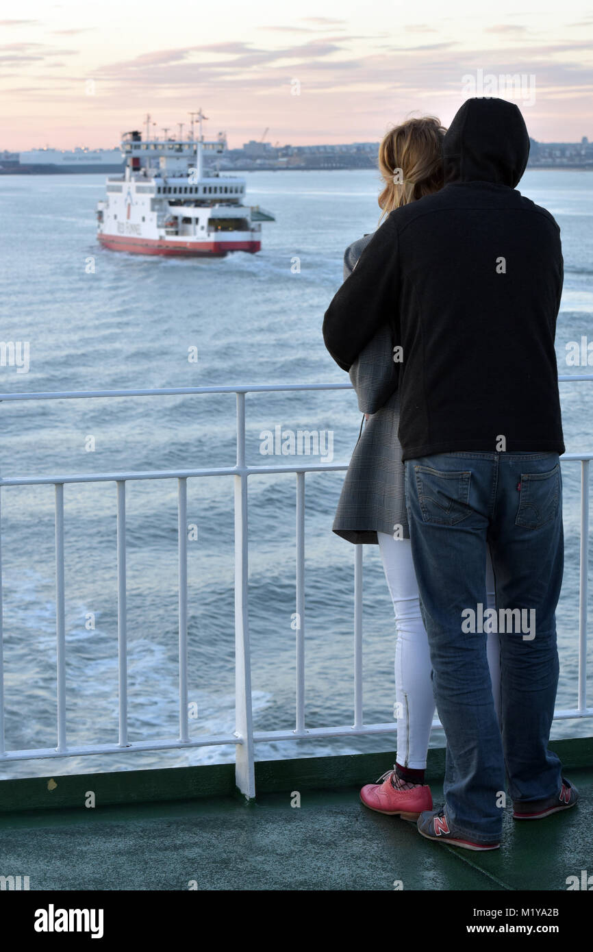 Woman wrapping arms around partner hi-res stock photography and images ...