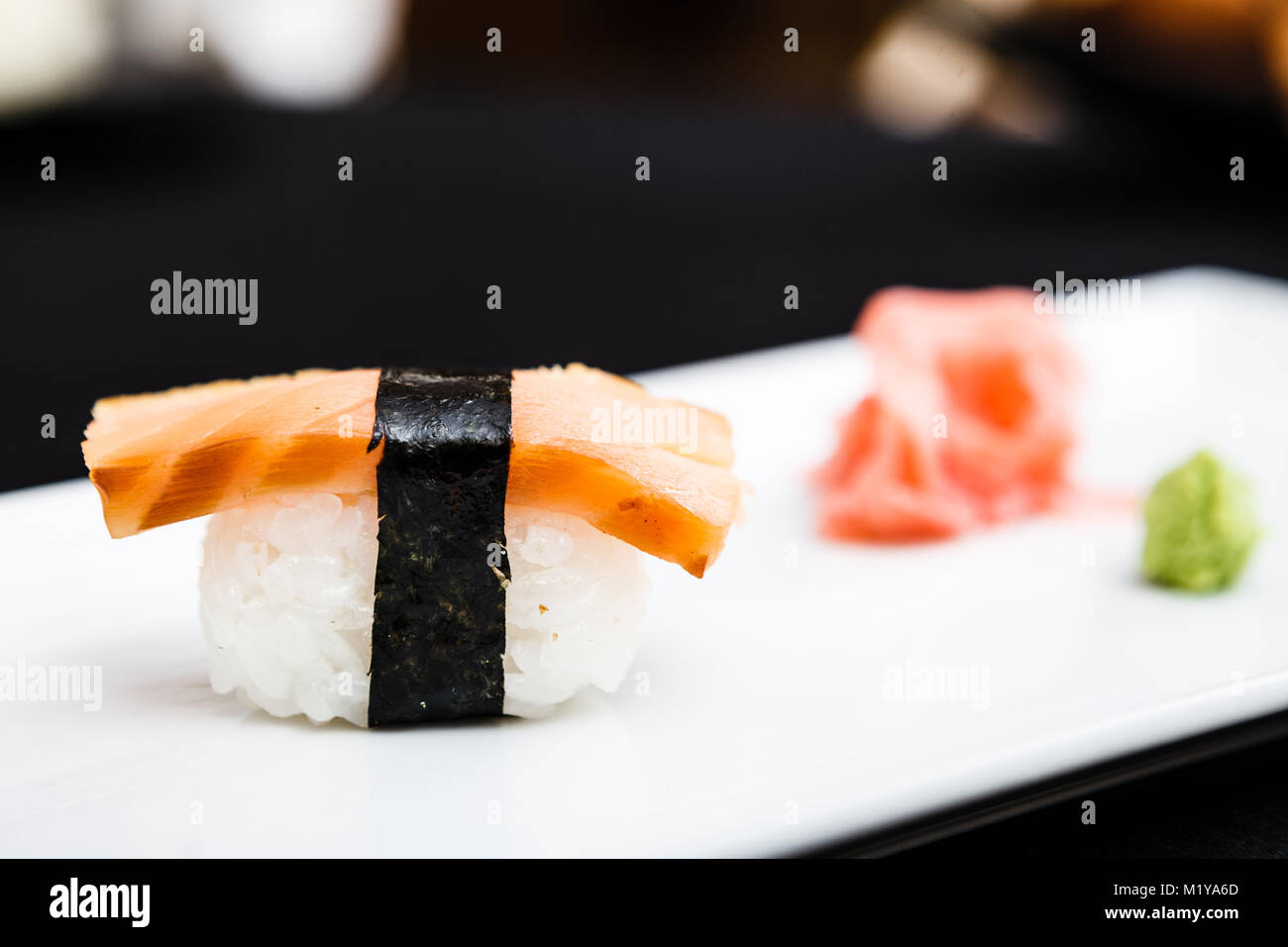 Smoked salmon sushi served on a plate Stock Photo