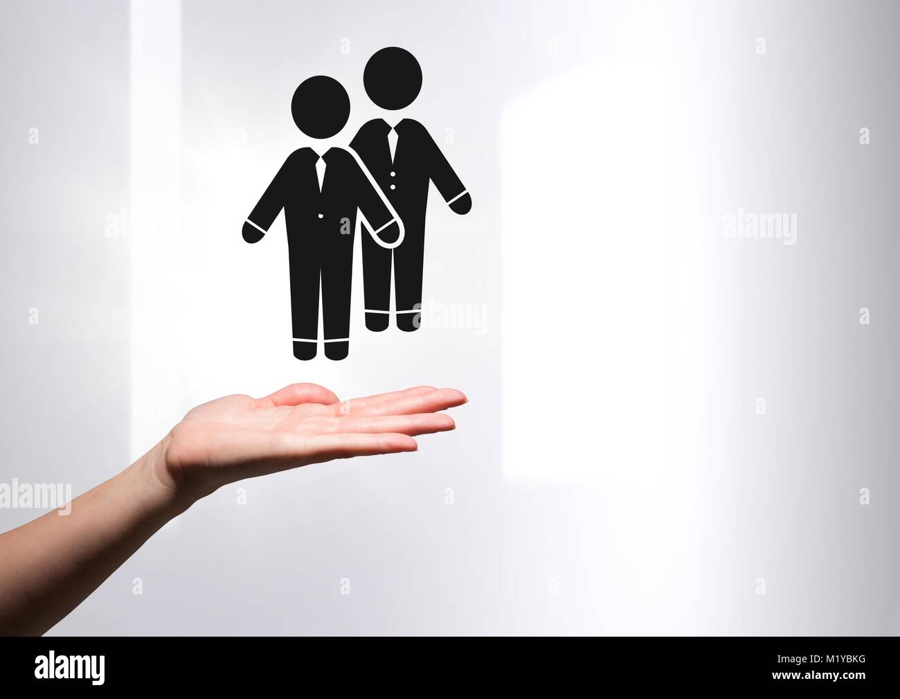 Hand open with business people couple partner icons Stock Photo