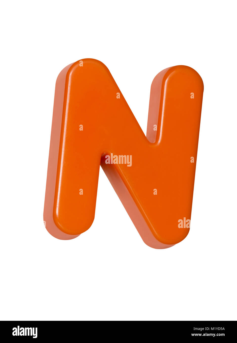 A cut out shot of an orange plastic letter 'N' Stock Photo