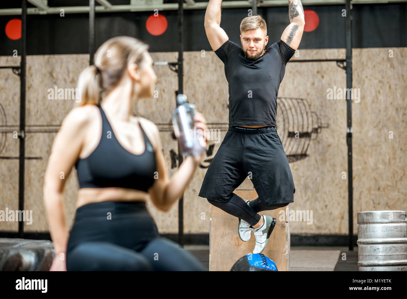 Couple training in the gym Stock Photo - Alamy