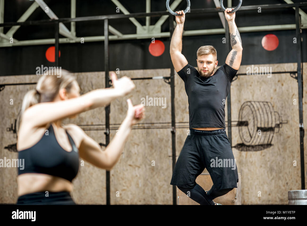 Couple training in the gym Stock Photo - Alamy