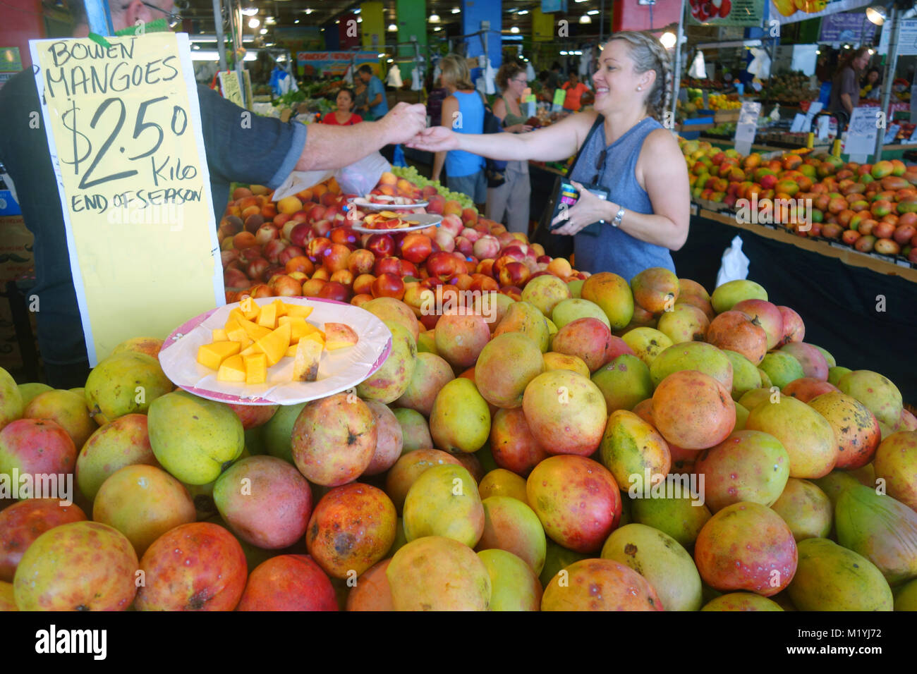 Mounds of seasonal mangoes and other fruits at Rusty’s Markets, Cairns, Queensland, Australia. NO MR or PR Stock Photo