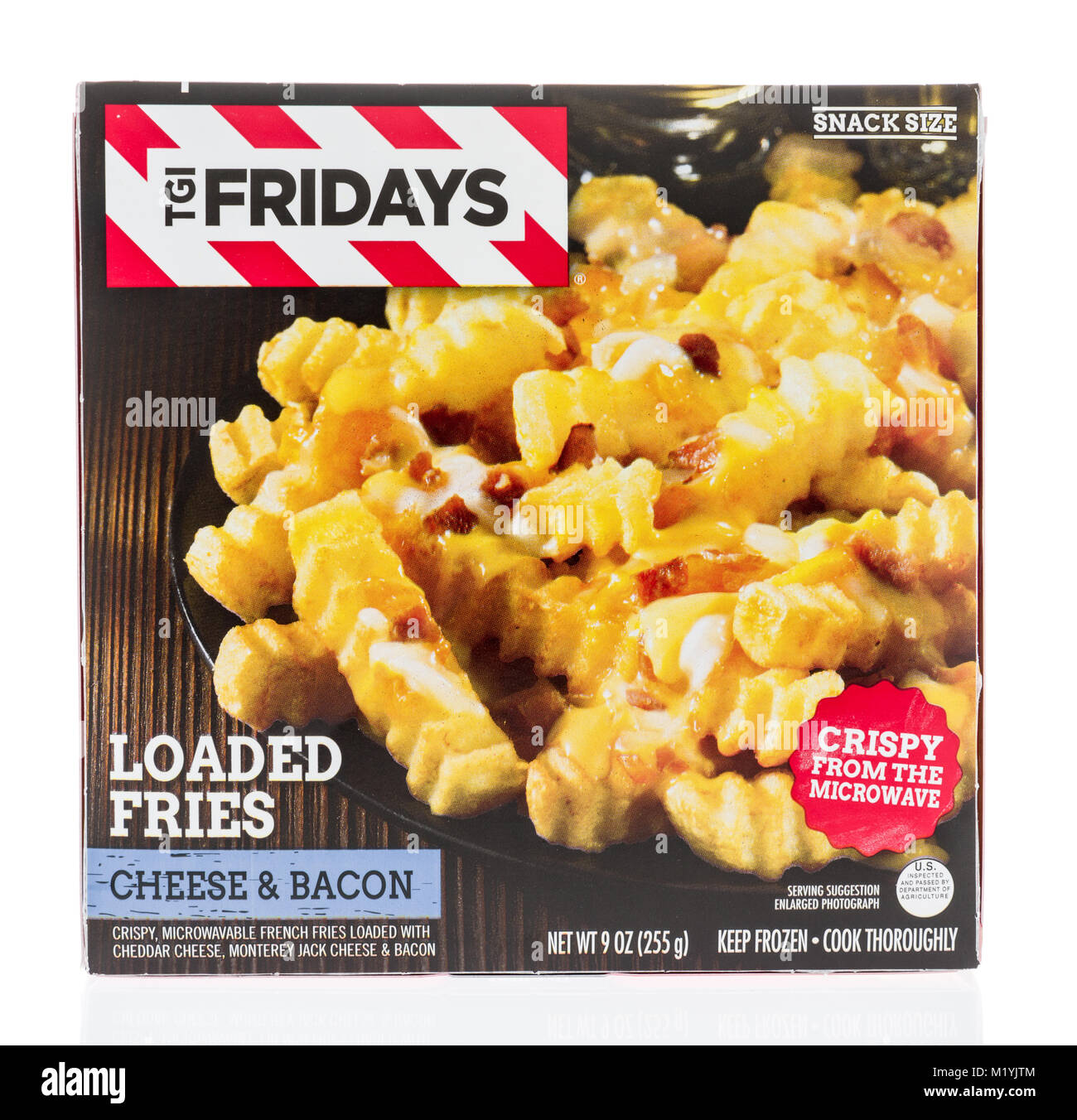 Winneconne, WI - 31 January 2018: A package of TGI Fridays loaded fries in cheese and bacon flavor on an isolated background. Stock Photo