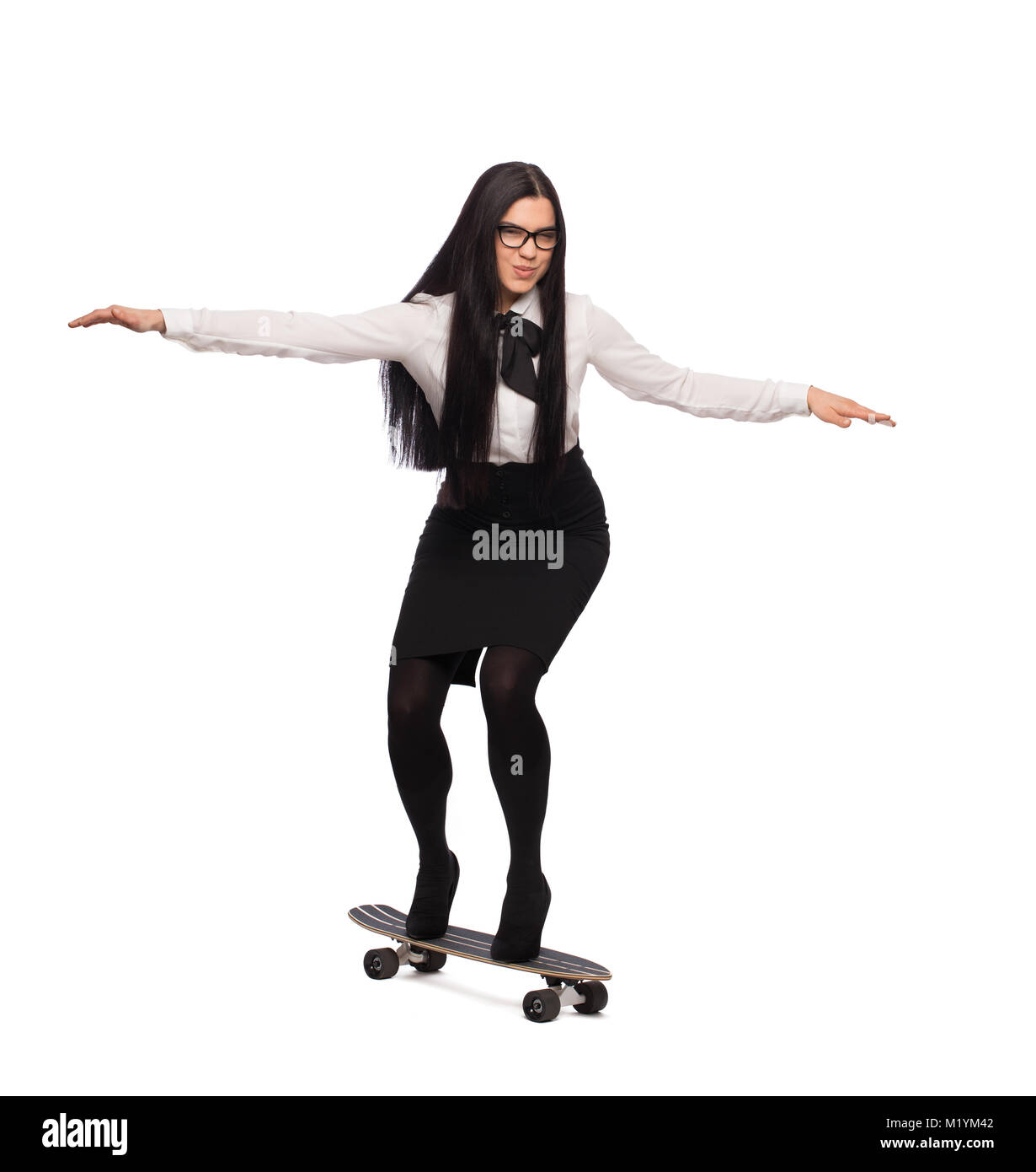 Young businesswoman riding on skateboard, isolated on white background Stock Photo