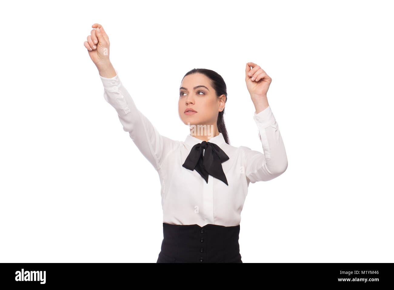 Young caucasian smart businesswoman working on imaginary futuristic screen, isolated on white Stock Photo