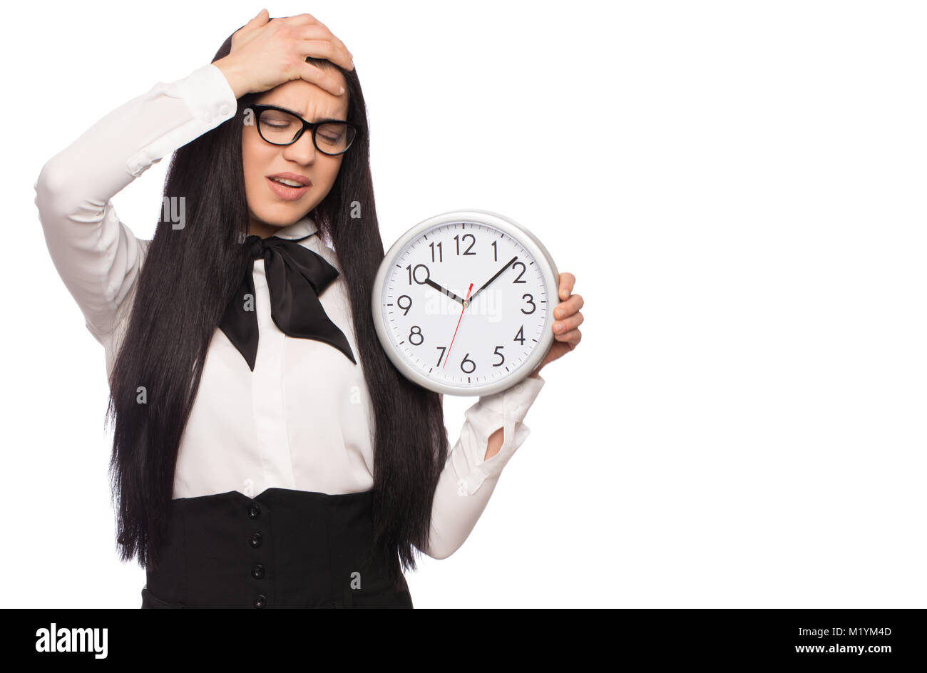 Caucasian businesswoman in formal wear has headache, holding clock, isolated on white Stock Photo
