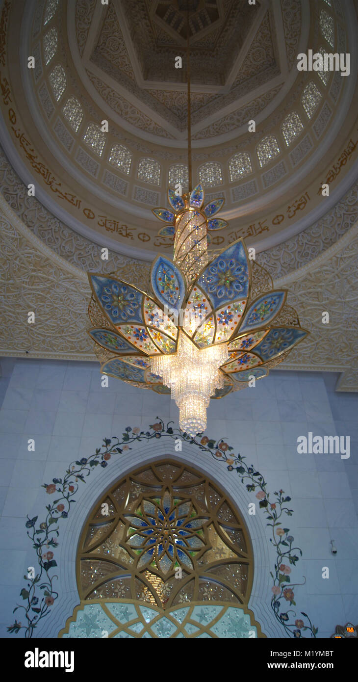 ABU DHABI, UNITED ARAB EMIRATES - APRIL 2nd, 2014: Interior design of Sheikh Zayad Mosque, Roof and chandelier inside the prayer hall Stock Photo