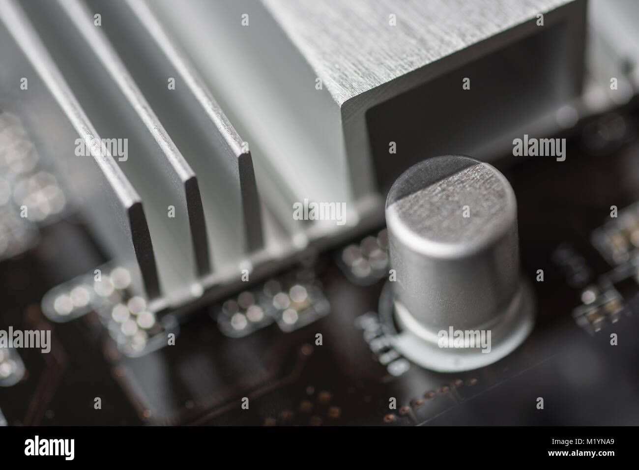 Capacitors and South Bridge Close Up. Computer Motherboard Background