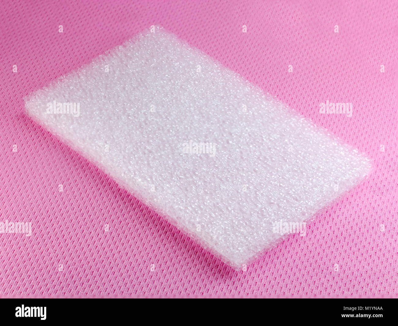 Shockproof material Polyethelene foam on pink background Stock Photo