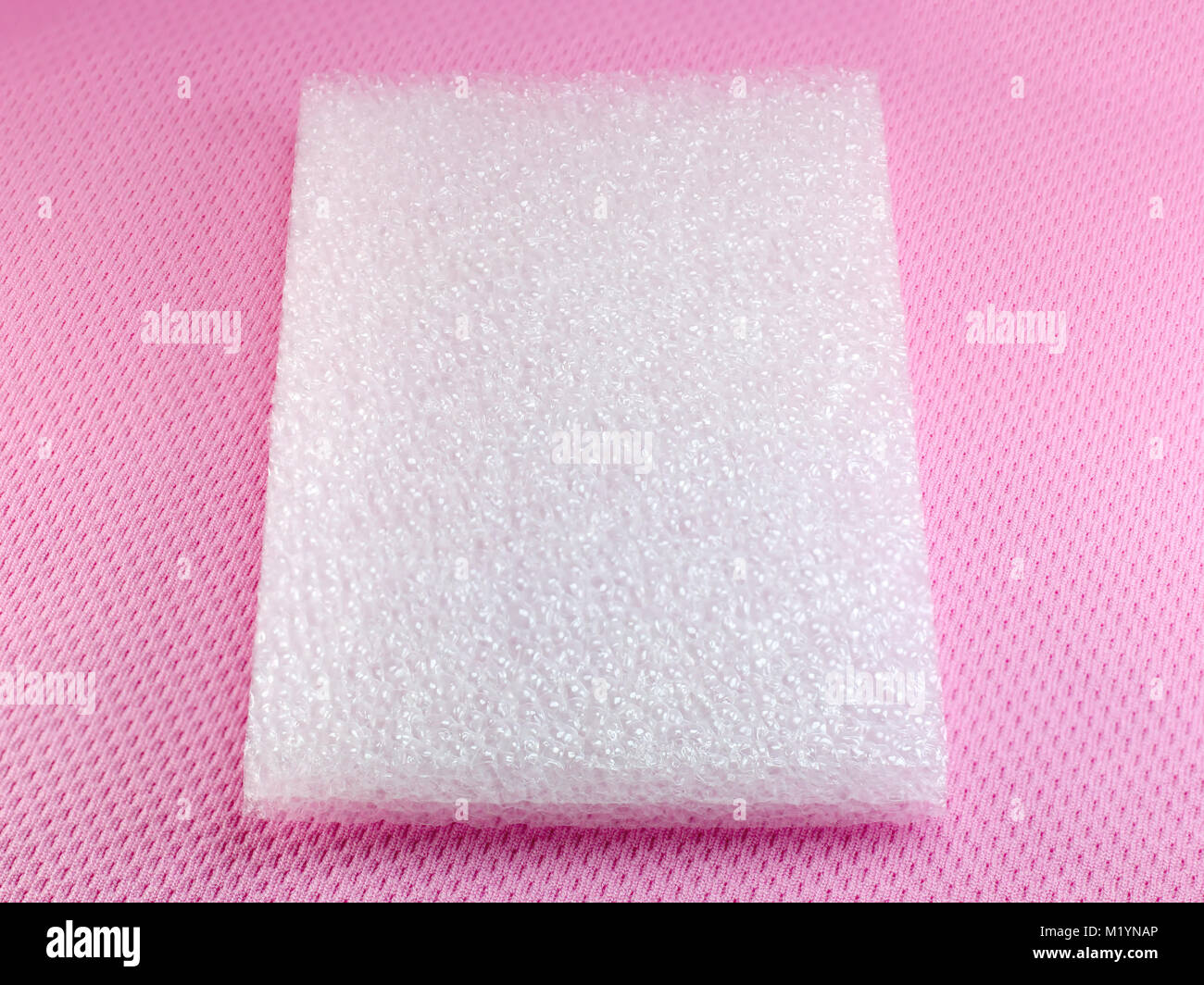 Shockproof material Polyethelene foam on pink background Stock Photo