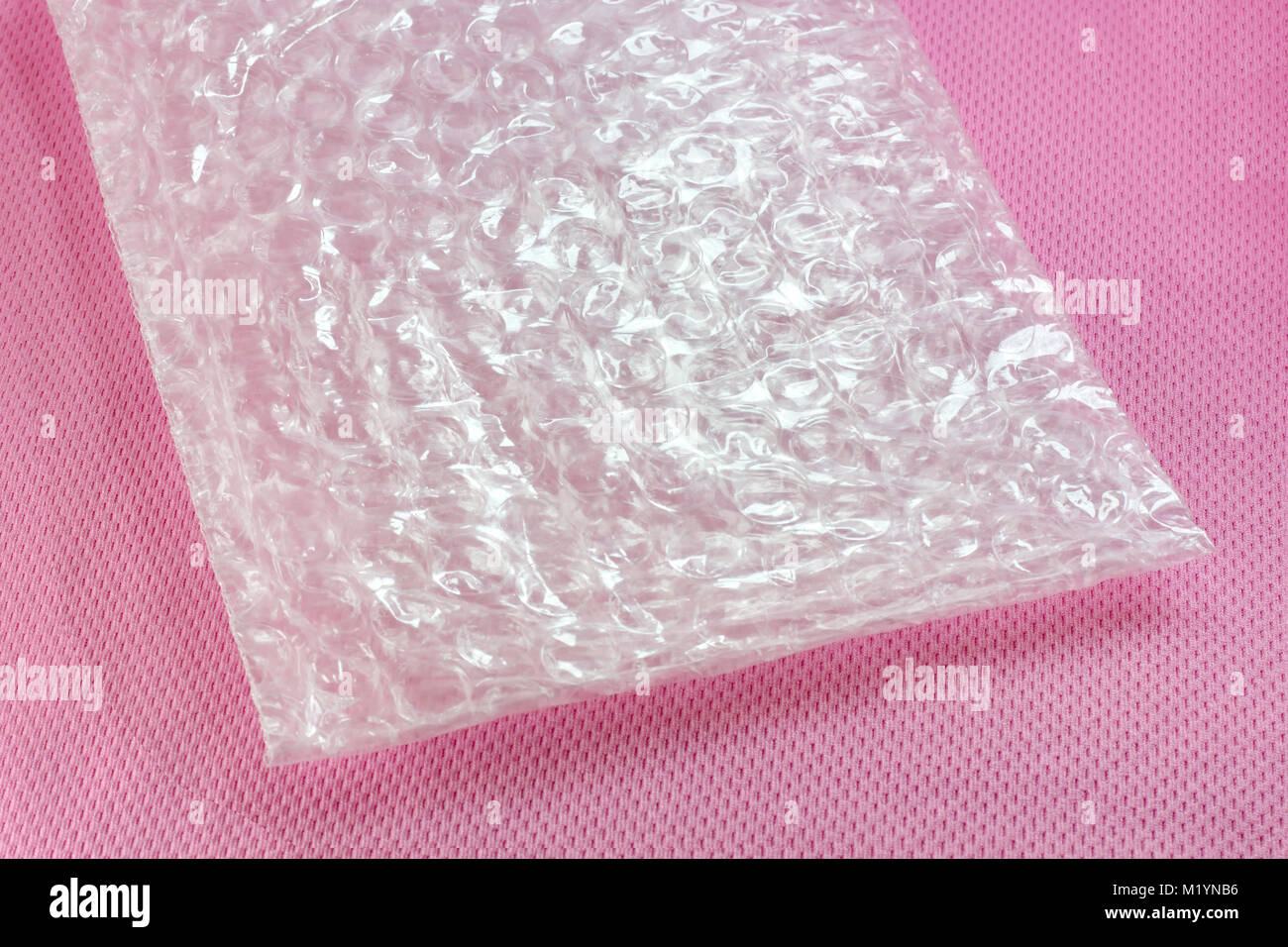 Shockproof material - Air Bubble Sheet on pink background Stock Photo