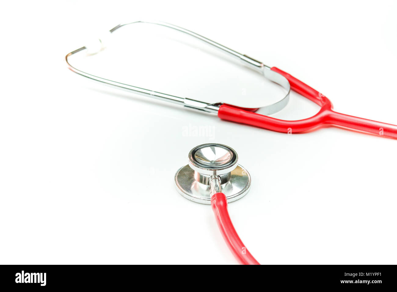 Red stethoscope isolated on white background Stock Photo - Alamy