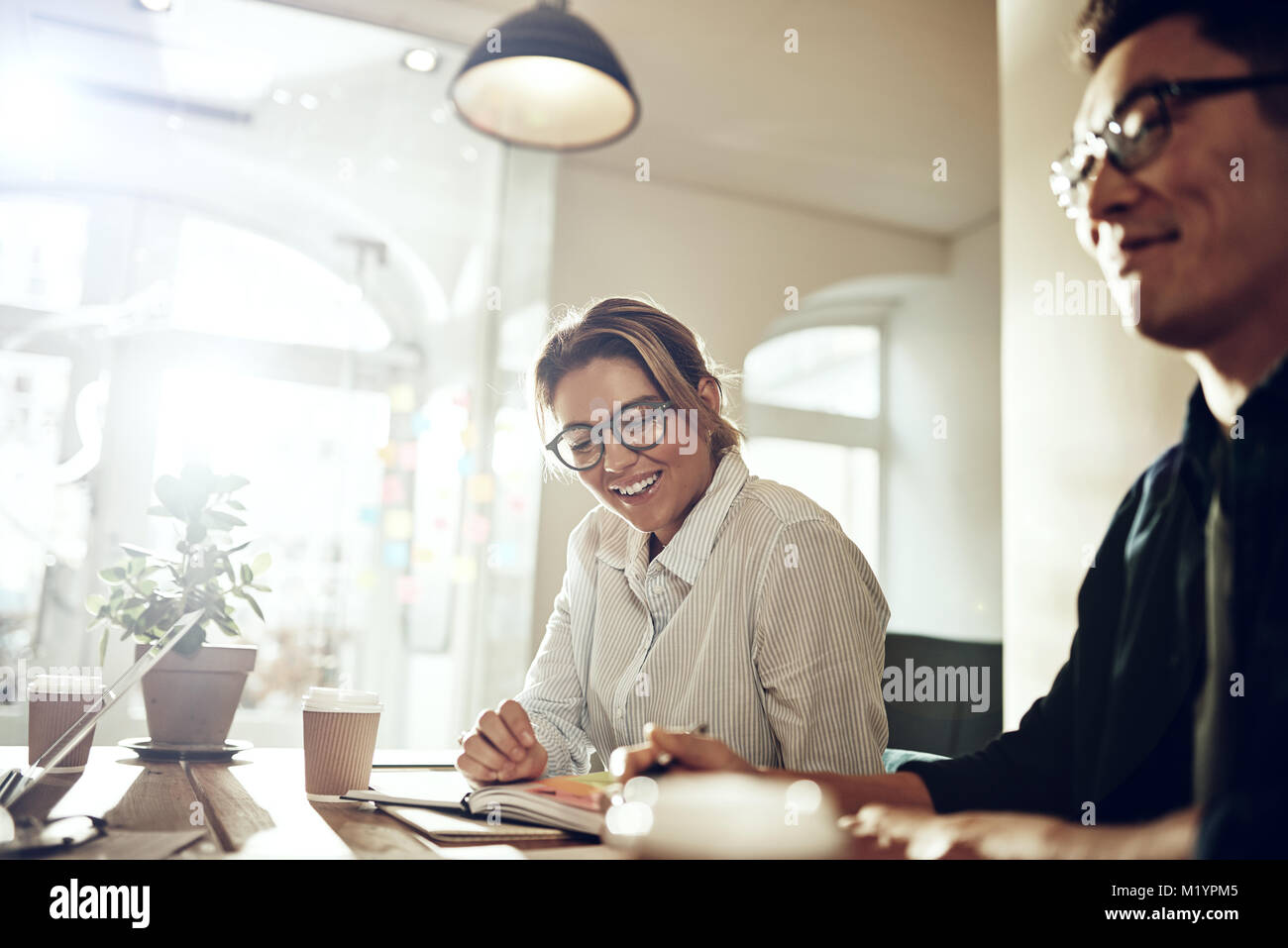 Two young asian startup coworkers hi-res stock photography and images ...