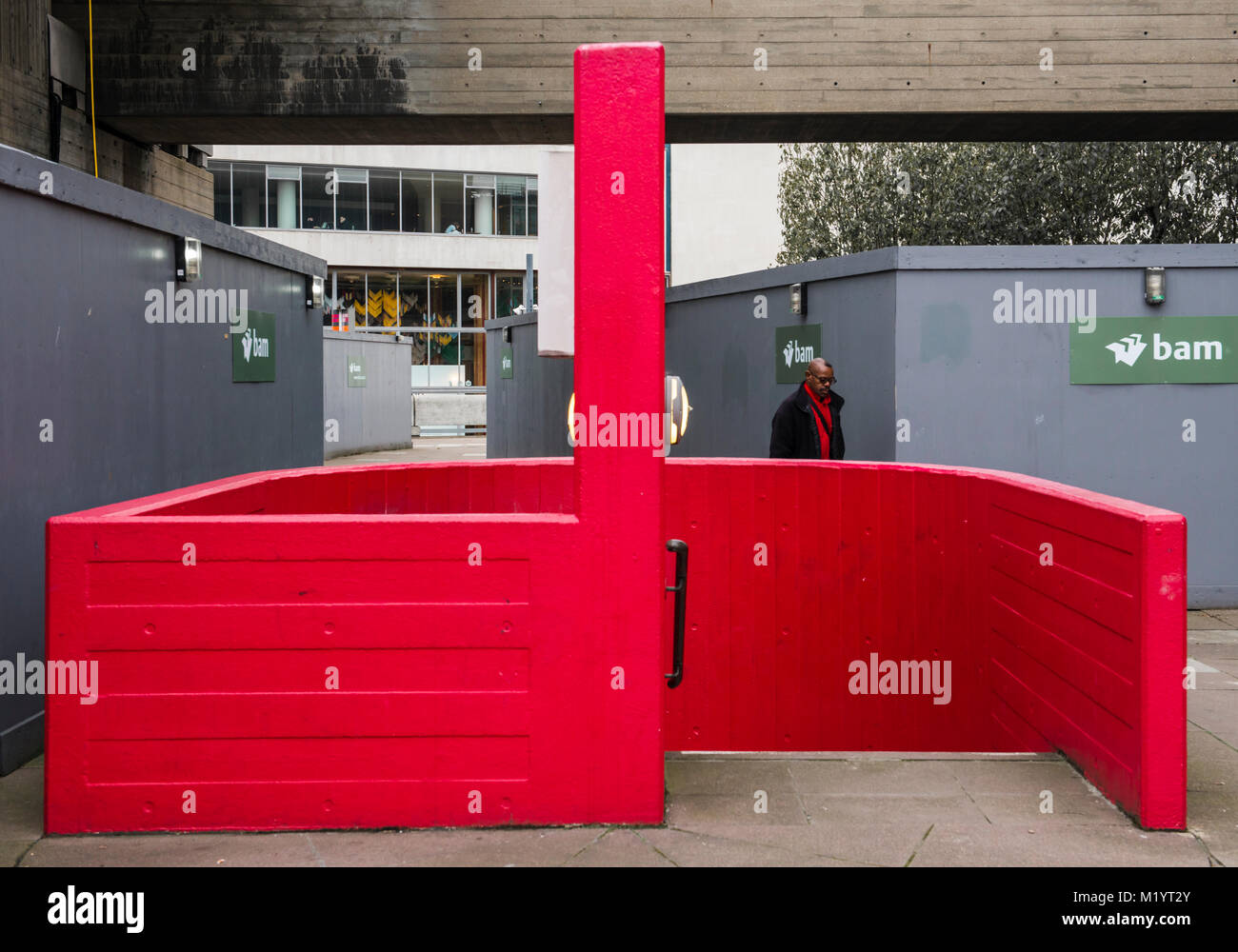 Bright red wall and steps, South Bank, London, England Stock Photo