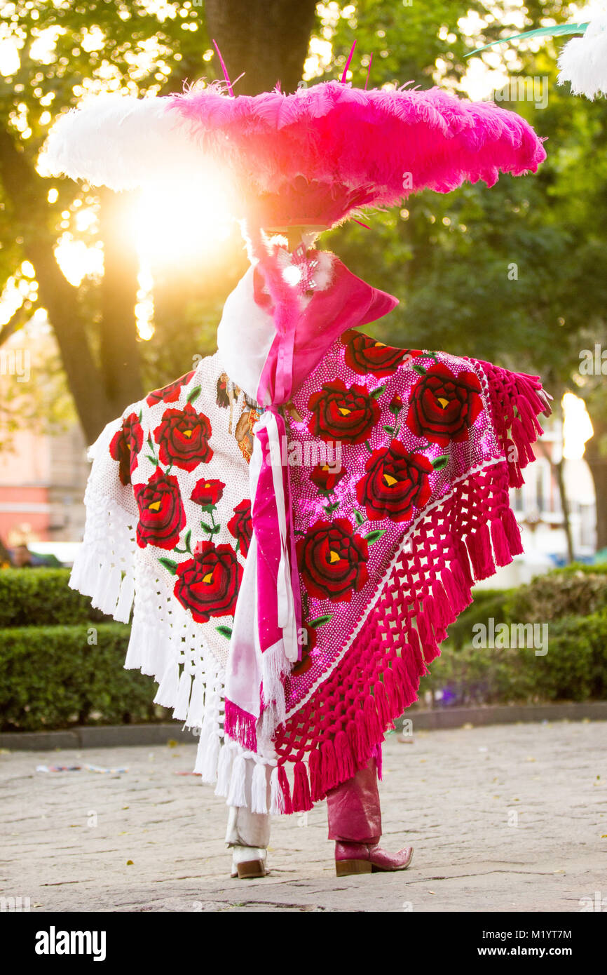 Vertical photo of a carnival dancer wearing a traditional mexican folk costume rich in color Stock Photo