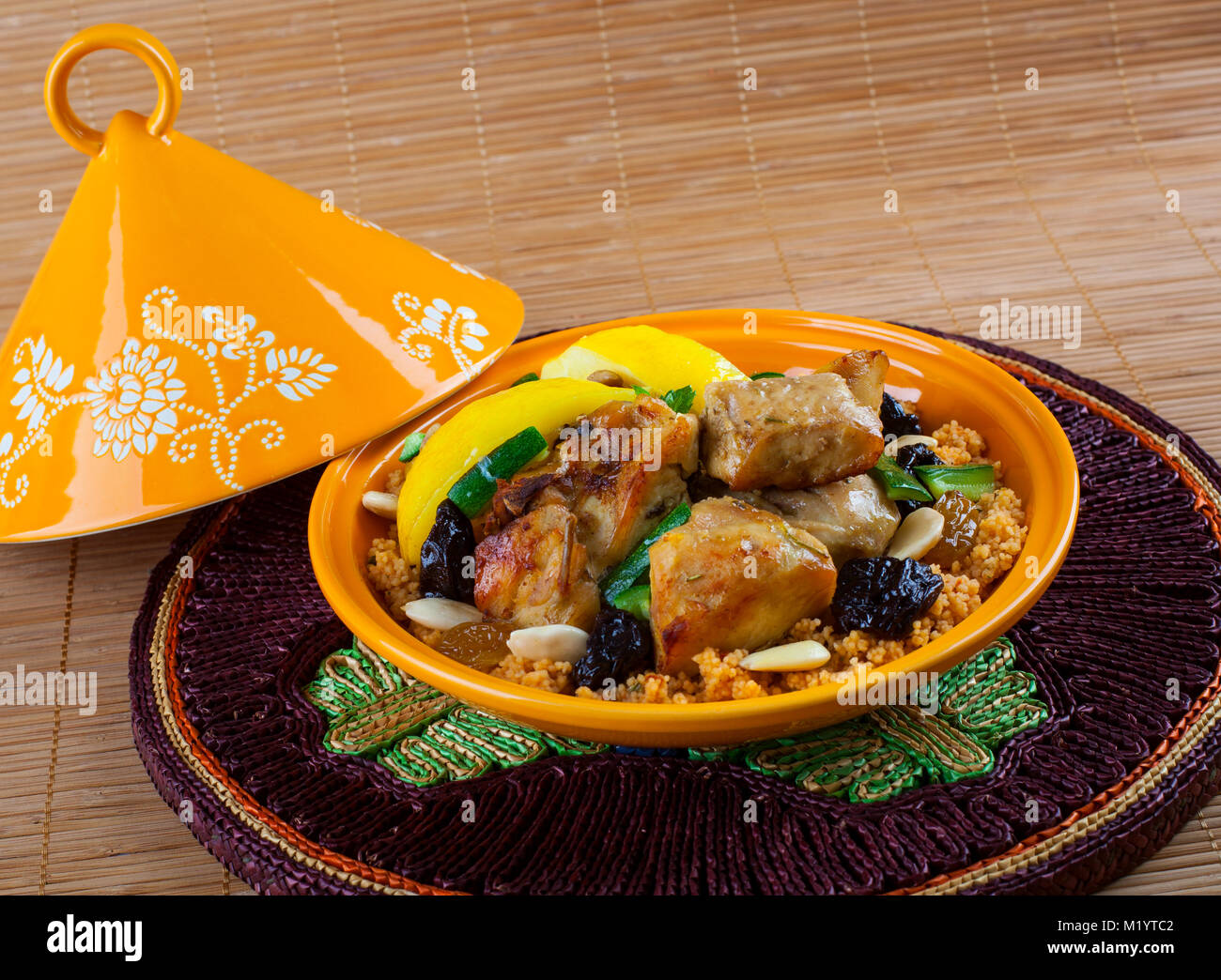 Tajine, Moroccan food, with cous cous, chicken and lemon confit. Stock Photo