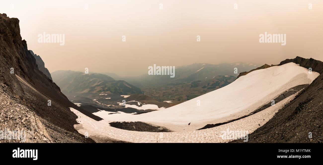Panorama from near the summit of the Black Tusk enveloped in forest fire smoke Stock Photo