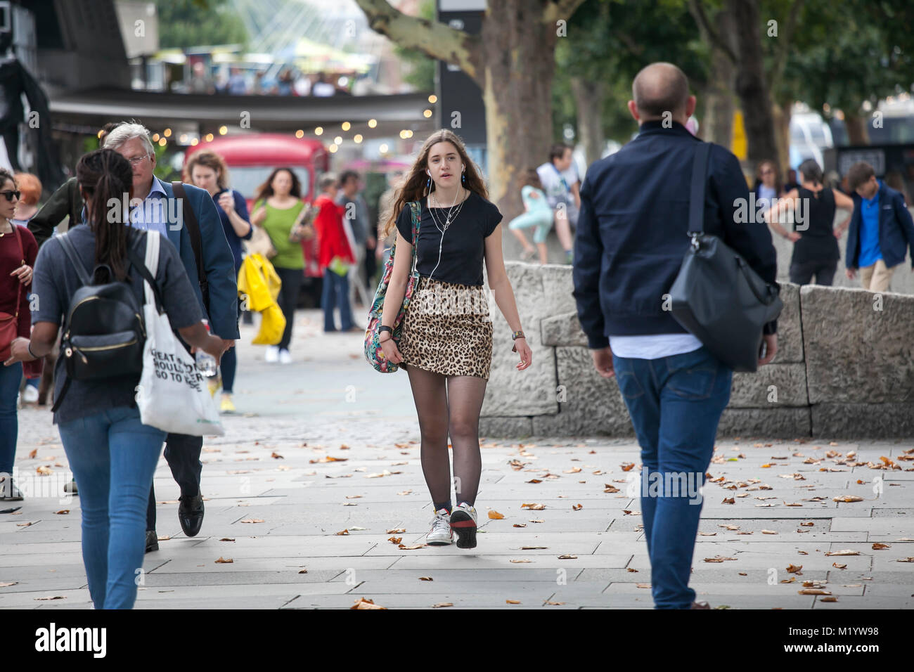 Woman in short skirt walking hi-res stock photography and images - Alamy