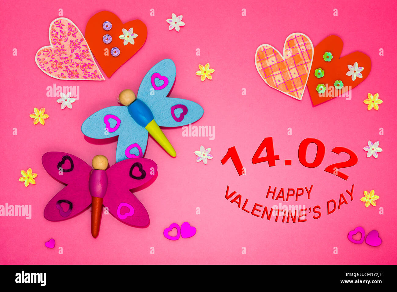 Valentines day card with hearts and dragonflies on colored background Stock Photo