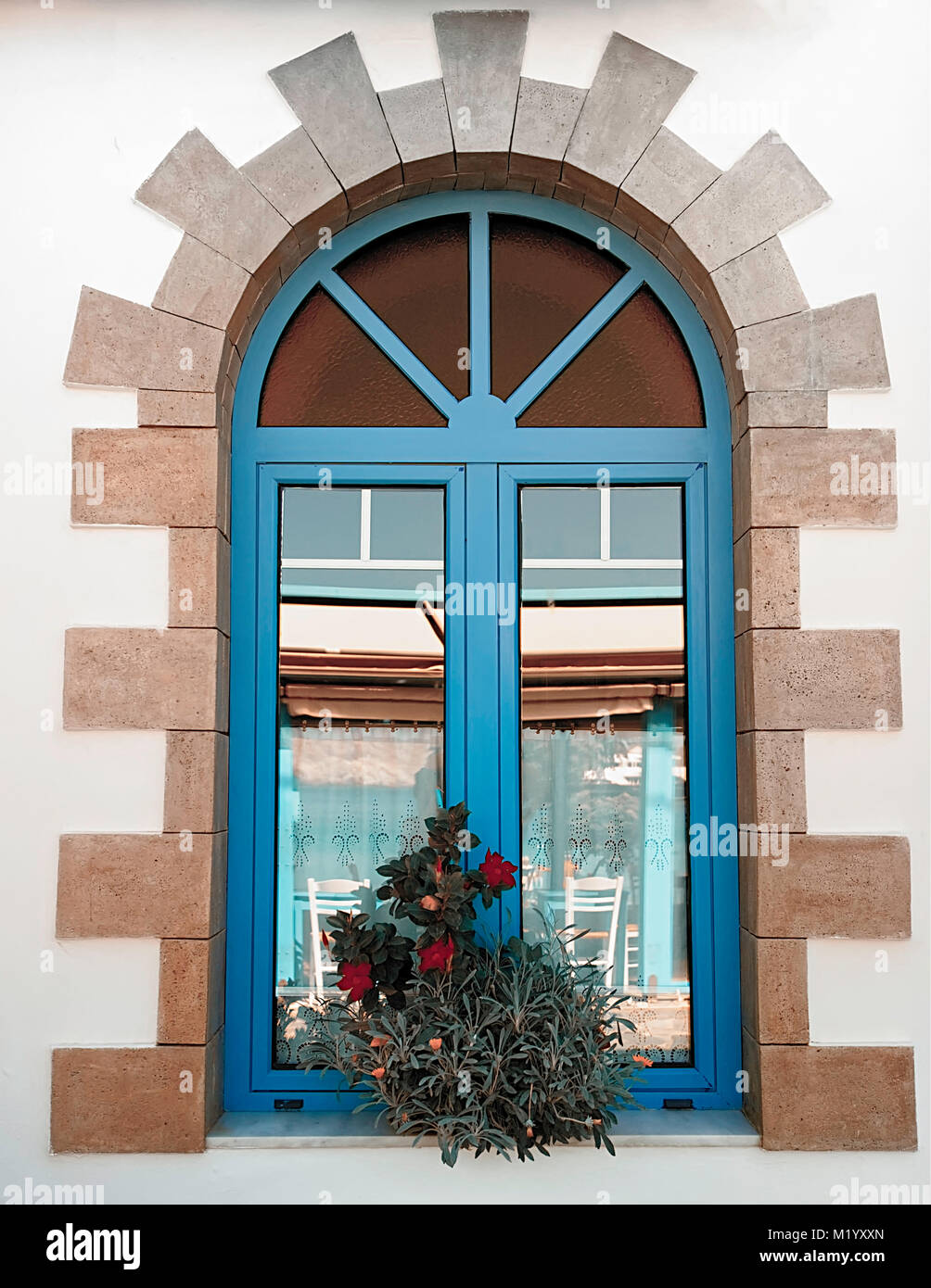 Greek Village Window. Mediterranean architecture. Stock Photo